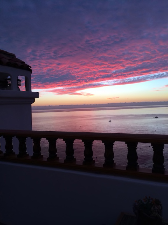 Pink sunset over the ocean from the balcony