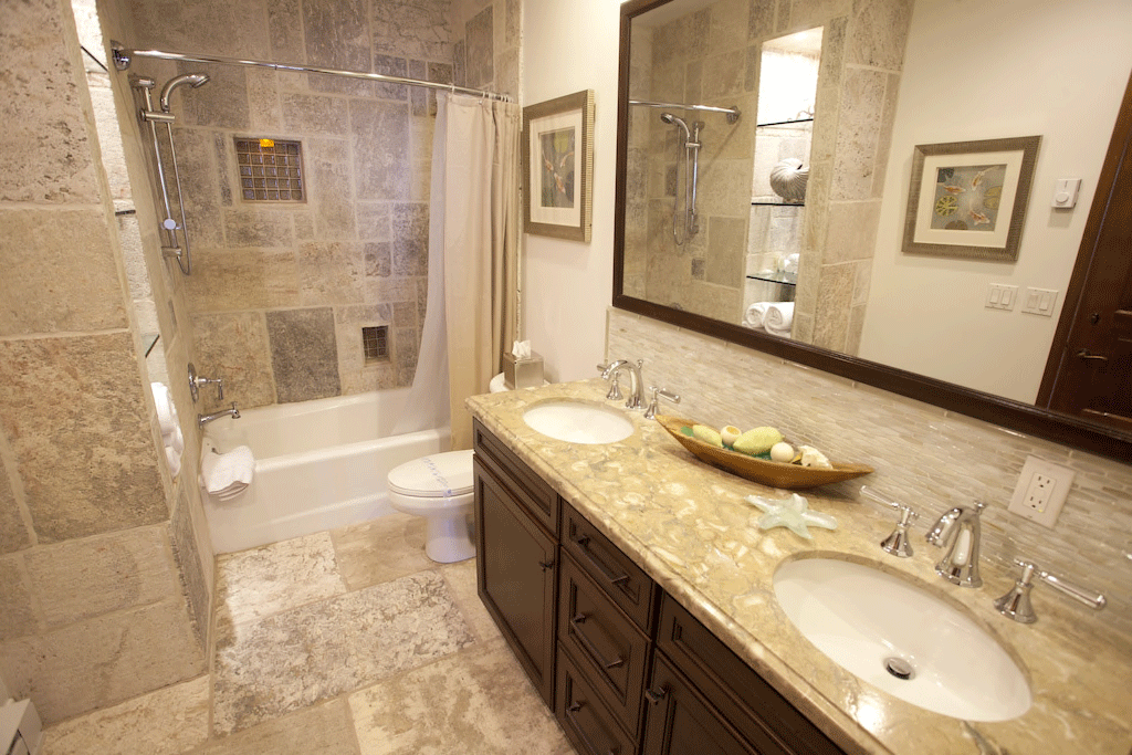 Bathroom with stone shower, tub and double vanity