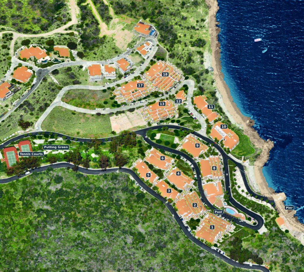 A map of Hamilton Cove showing the buildings, the beach, the pool and the paths between them.